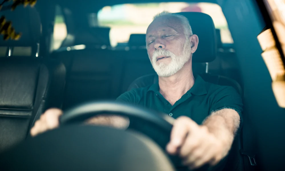 man fell asleep at the wheel of a car